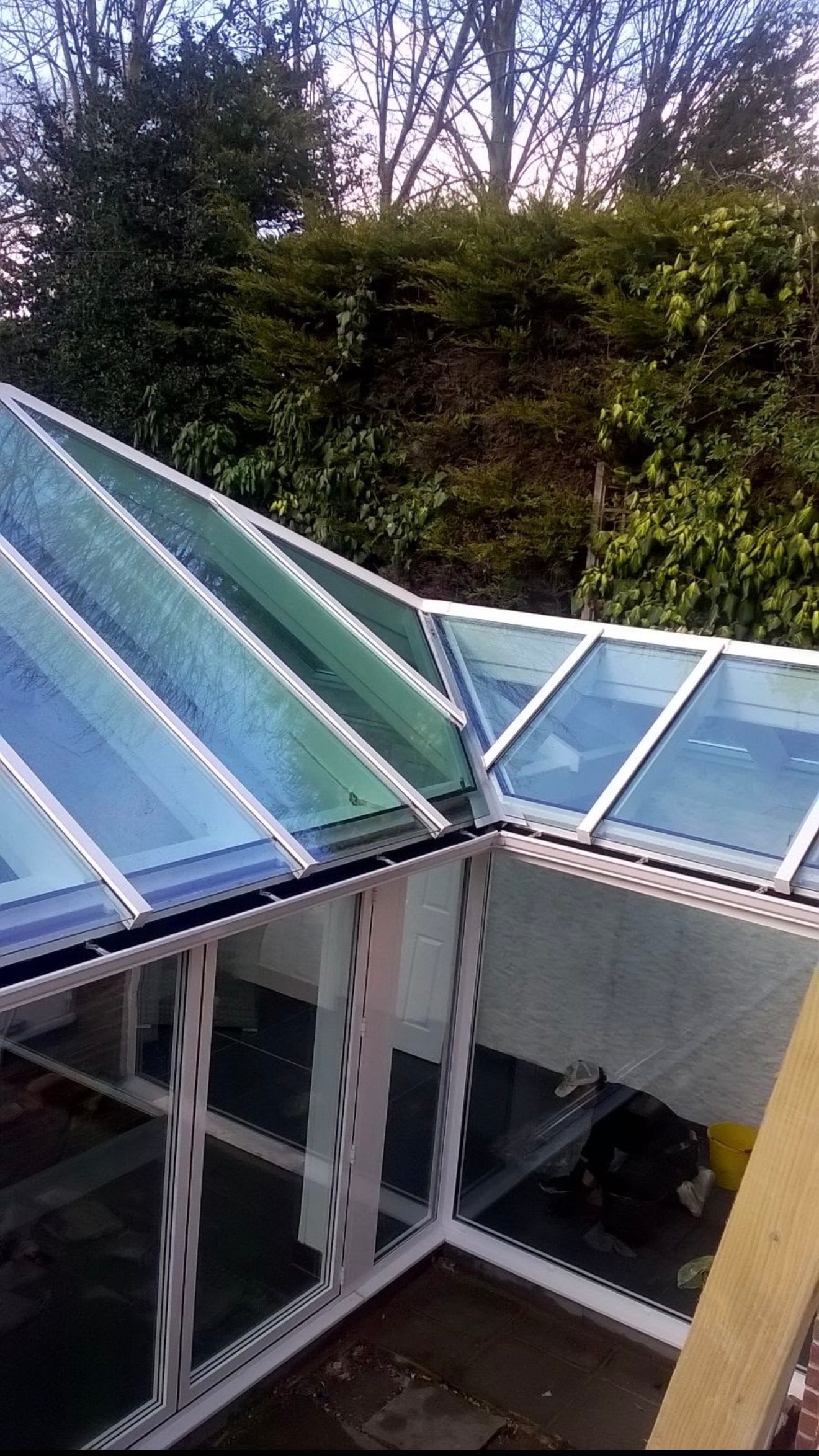 Large L-shaped conservatory roof clean